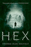 Paperback book titled HEX by Thomas Olde Heuvelt, with cover image featuring dark, eerie artwork and the title prominently displayed