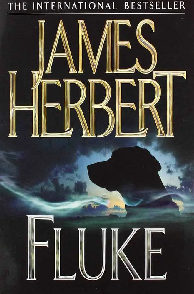 Paperback book titled "Fluke" with a white cover and colorful design, featuring the title prominently on the front.