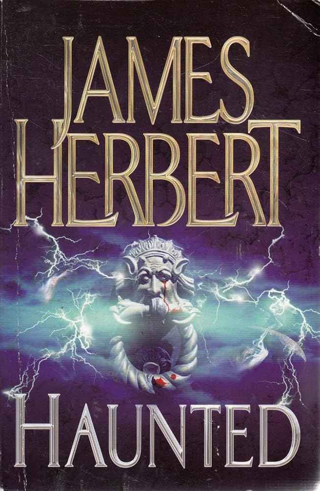 Paperback of Haunted by James Herbert, showing the book cover with spooky haunted house illustration and dark background.